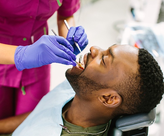 Man seeing dentist in Alexandria