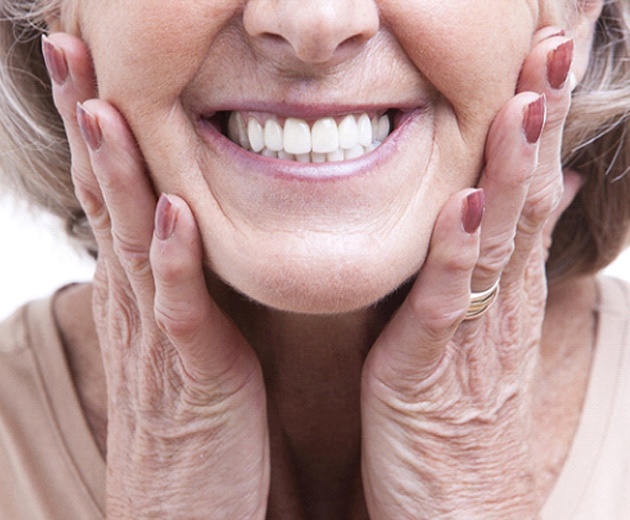 Closeup of woman’s smile after full mouth restoration in Alexandria
