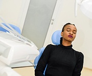 Woman relaxing with IV dental sedation in Alexandria