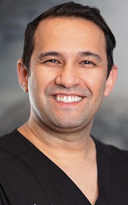 Headshot of Dr. Amir Naimi BURKE