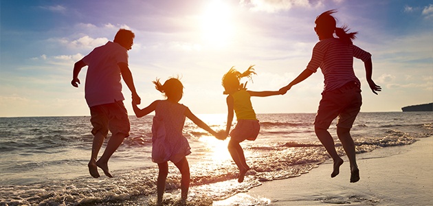 Family of four at the beach