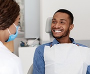 candidate for oral conscious sedation in Alexandria smiling at dentist