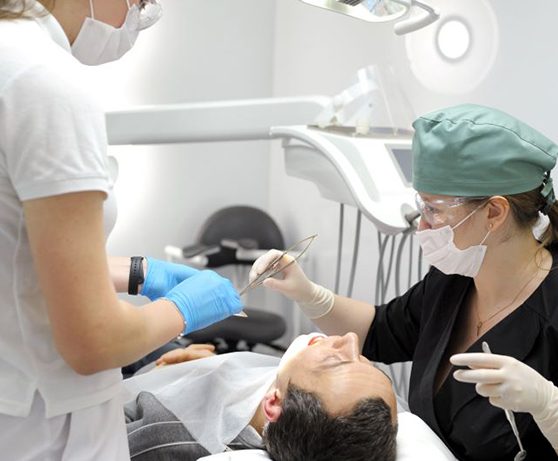 Dental team working on patient’s mouth