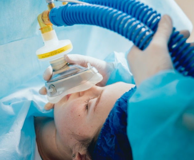 Patient under general anesthesia during oral surgery