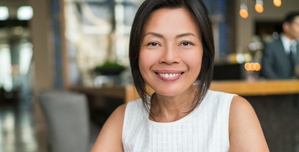 Woman with healthy smile after restorative treatment