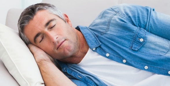 Man relaxing after oral surgical sedation treatment