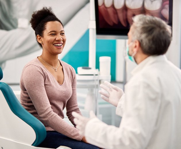 patient talking to dentist 