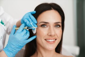 Woman with long dark hair receiving Botox injection